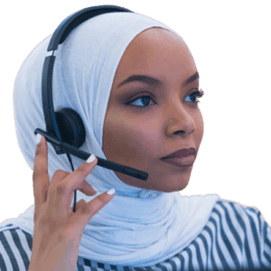 A person wearing a white hijab and a black headset is adjusting the microphone while looking thoughtfully into the distance. They are dressed in a striped shirt against a plain background.